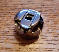 (image for) Bobbin Case, Pigtail, Works with Bobbin 55623NS, Item BC77